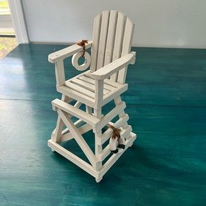 White wooden lifeguard chair.